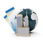 globe and buildings with plane tickets