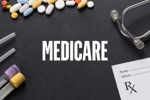 61657175 - medicare written on black background with medication